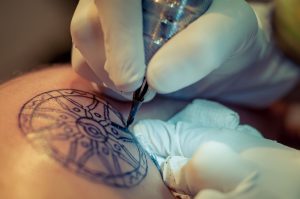 Tattoo artist at work